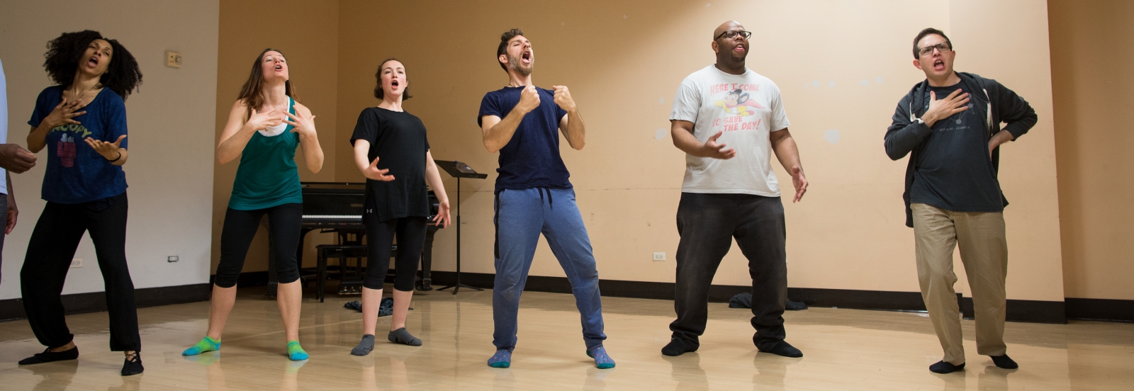 a group of adults practice vocal techniques in Jon Stancato's "Sing a Secret" workshop